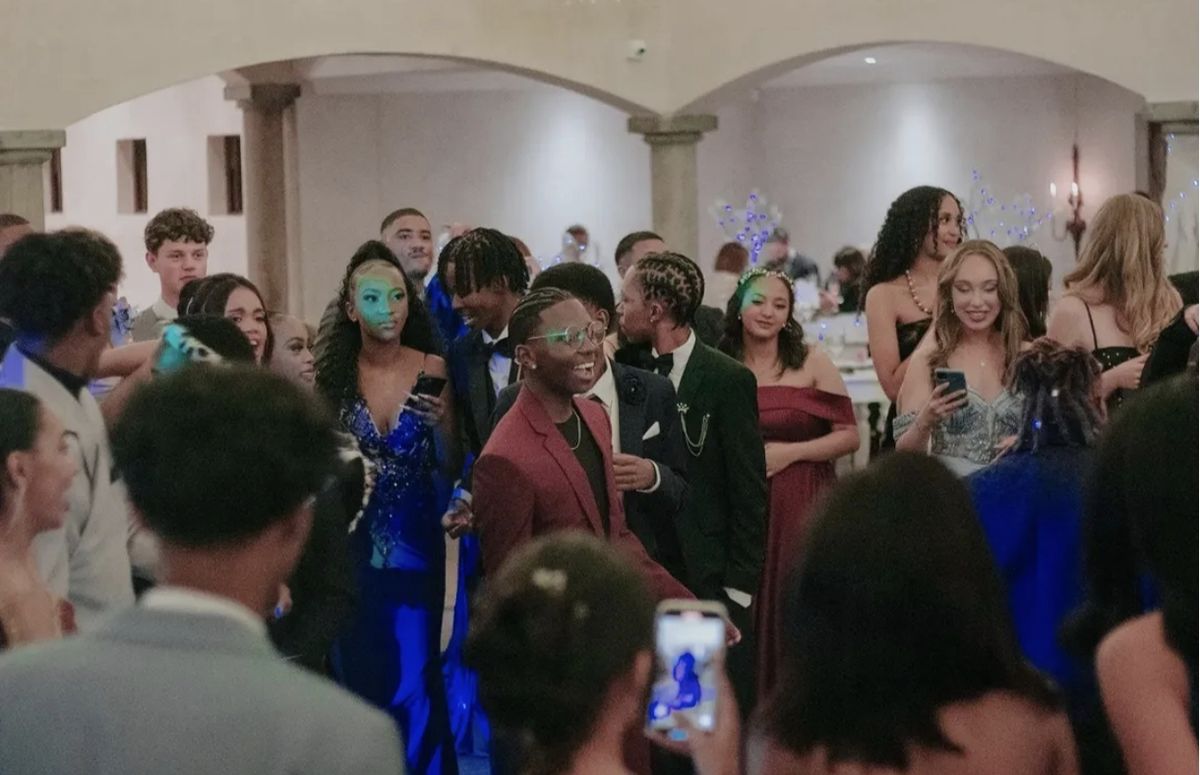 Guests laughing and filming on the dance floor at a matric ball